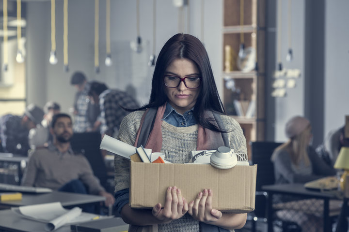 A woman with a box of office stuff Getty Images