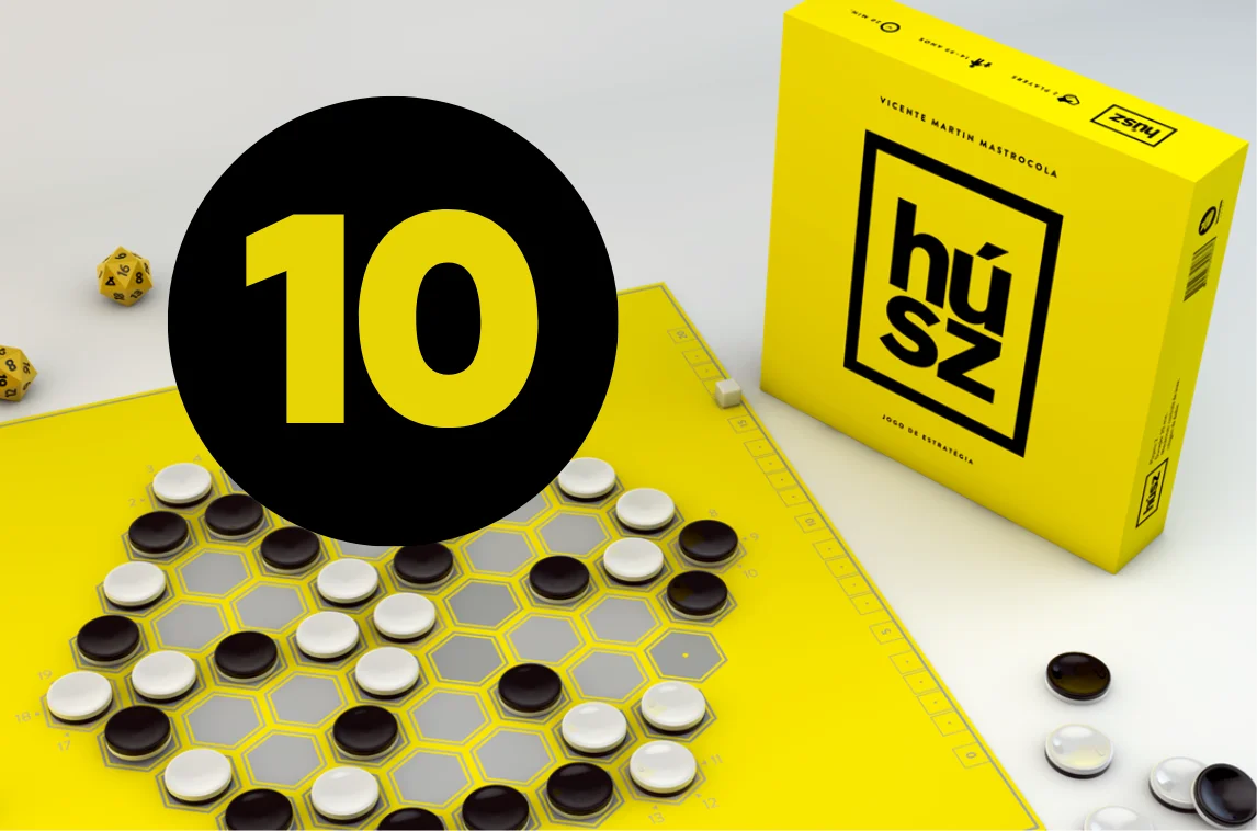 Board game set with black and white pieces on a honeycomb pattern, dice, and yellow strategy game box.