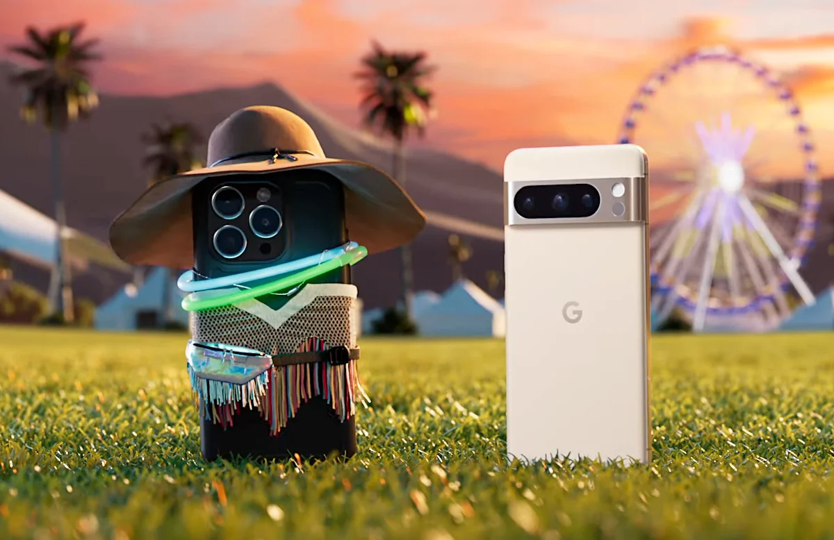 Smartphone with multiple cameras styled with a hat and sunglasses on grass with a ferris wheel in the background at dusk.
