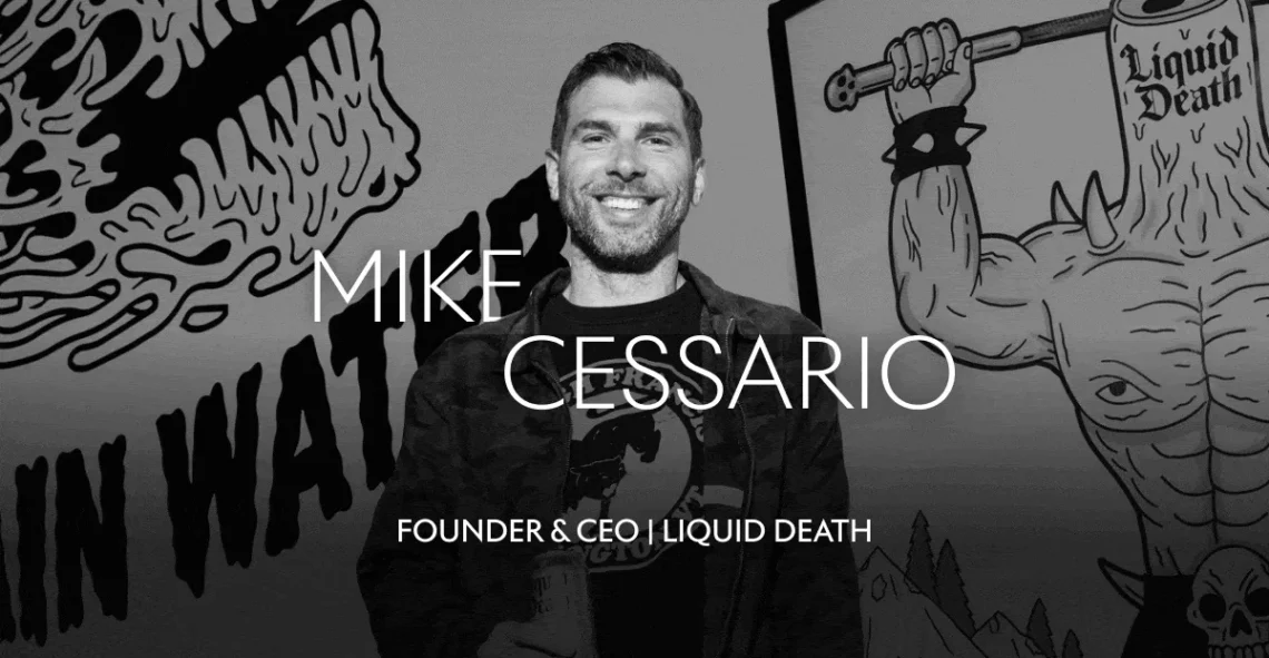 Mike Cessario, Founder and CEO of Liquid Death, smiling in front of brand mural with edgy artwork.