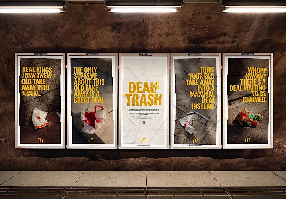 McDonald's ad campaign posters on subway station wall promoting deals on takeout food.