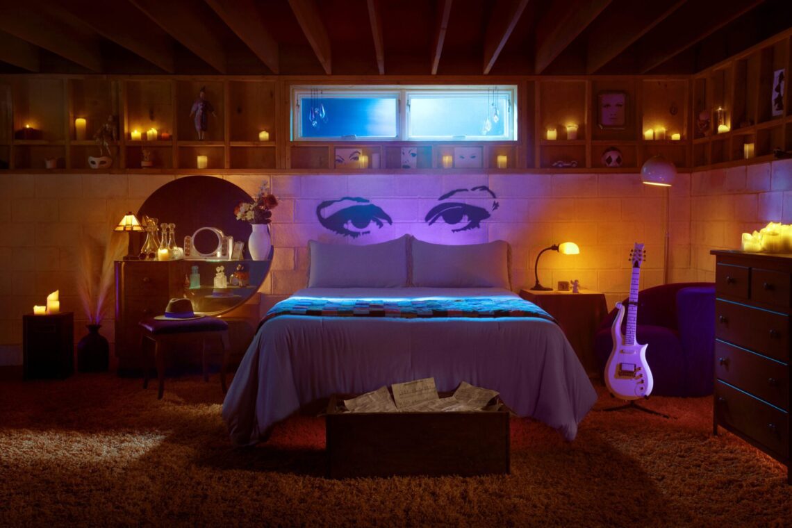 Cozy attic bedroom interior with artistic mural, candles, guitar, and ambient lighting.